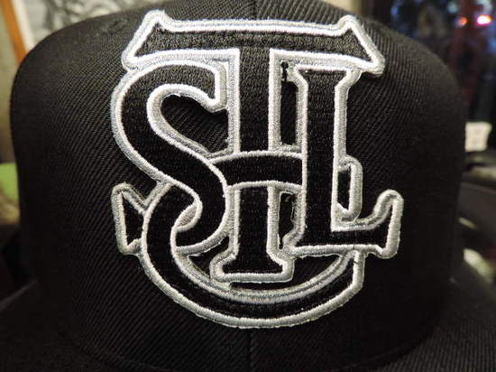 THE SEVENTH LETTER EMBREM.JPG